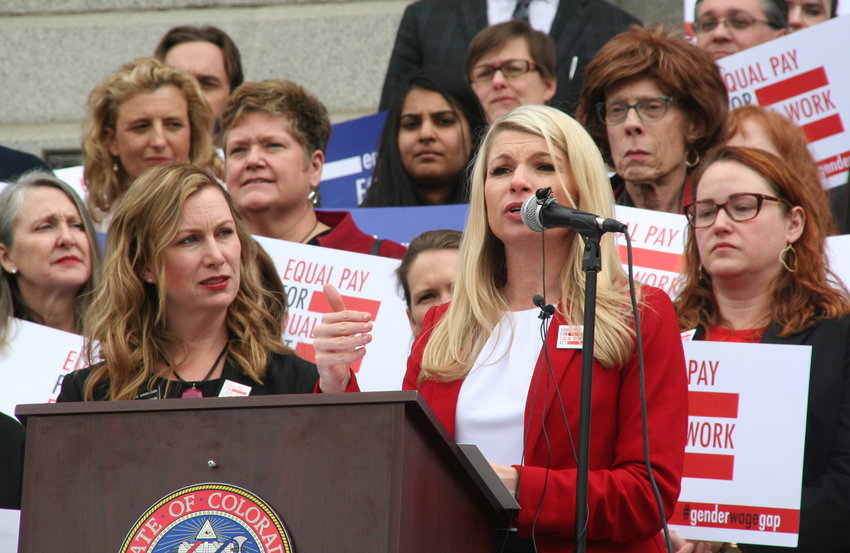 Sen. Brittany Pettersen, D-Lakewood, explains SB 19-085, the Equal Pay For Equal Work Act bill, to a crowd that gathered on April 2 — 2019’s Equal Pay Day — at the steps of the capitol building in downtown Denver. To Pettersen’s left is Jessie Danielson, D-Lakewood, another sponsor of the bill.